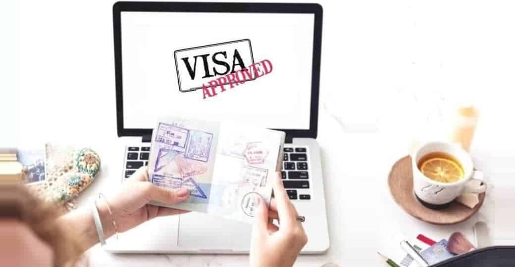 Consulate agent holding passport with student visa approved