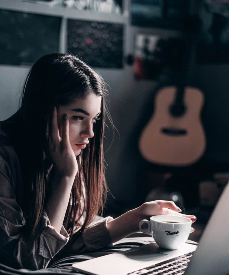Female student at her laptop for bachelor degree admission