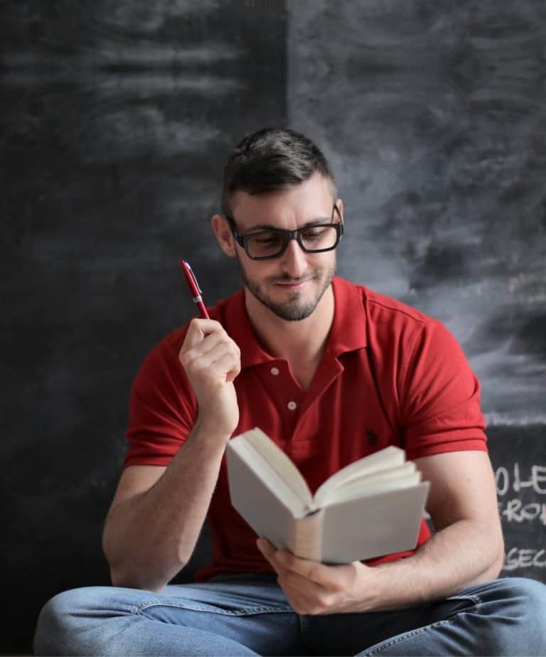 Male student revising for his PhD degree admission admission